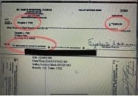 An alleged reimbursement check, just shy of the amount requiring IRS reporting